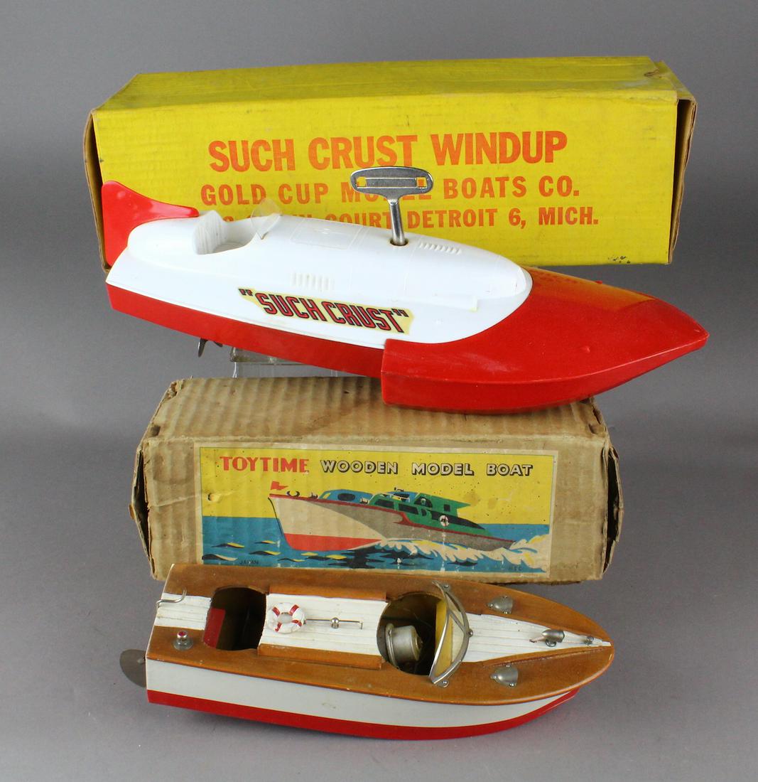Toytime & Suchcrust Model Boat in Box: Suchcrust Wind up Gold Cup model speedboat in the original box- working toy. Japan Toytime Wooden model cabin cruiser with motor in the original box.