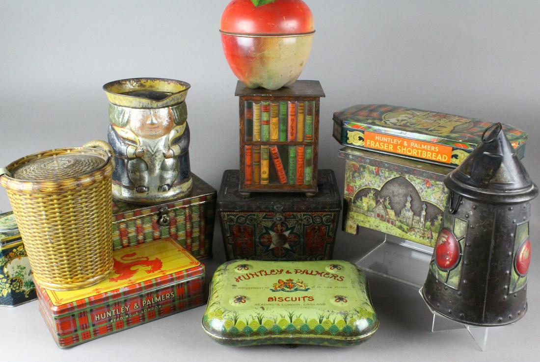 Huntley & Palmer British Biscuit Tin Collection: Huntley & Palmer British Biscuit Tin Collection. Includes the desirable bookcase stand, lantern, wicker, Toby jug etc. Great group.