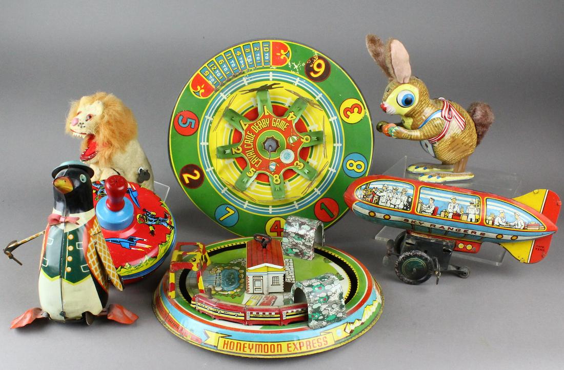Tin Toys Marx Japan, Wyandotte: Marusan wind up penguin, Marx Lion, Wyandotte Horse race wheel, Marx Honeymoon Express mechanism sticks, Sky Rangers Zeppelin mounted to rolling wind up, tin Japan Bunny wind up.