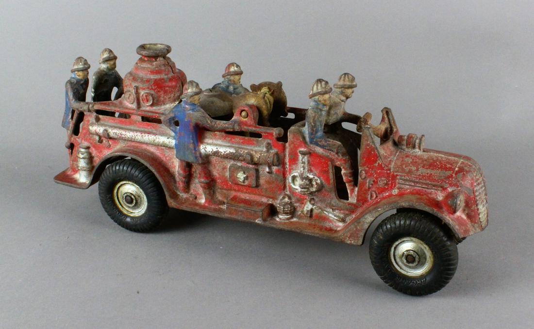 Arcade Ford Fire Apparatus Truck: Arcade 1939-1940s Six Man Fire truck. Pumper and all activity fire fighting truck. Large 13 inch truck. Chip to front fender, paint wear.