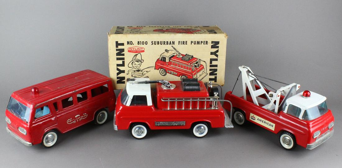 Ford Fire Set of 3 Nylint & Boxed: 1960s Nylint Ford Suburban Fire Pumper in the box, American Gas Wrecker, and Ford Rescue Squad. All very good to excellent, Ford Econoline Fire Rescue Van has a cracked windshield.
