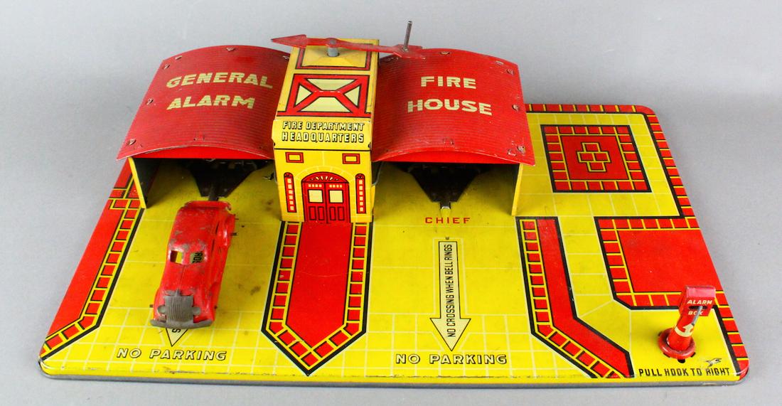 Marx Tin General Alarm Fire House with Car: Marx General Alarm Fire House with Car. Original arrow winder on this alarm car launch fire house. Working wind up and original car.