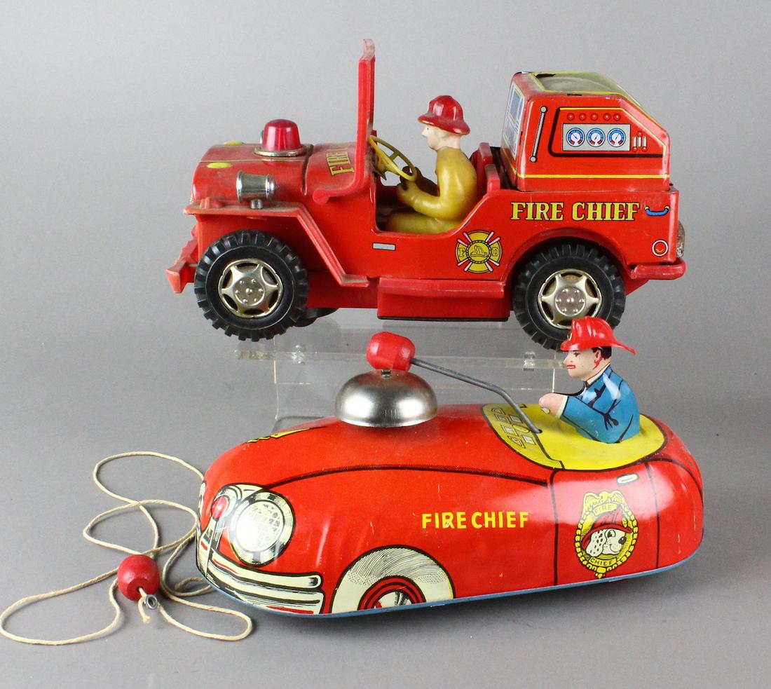 Tin Fire Chief and Marusan Fire Chief Jeep: Tin Fire Chief pull and ringing bell toy and Japan tin Marusan Fire Chief Jeep. Both 9 inches long.