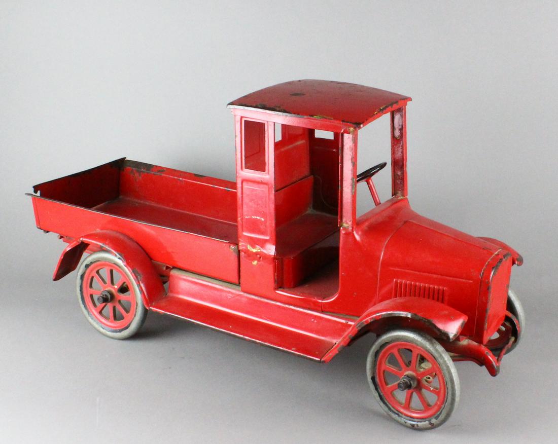Buddy L IH International Harvester Truck: 1920s Buddy L IH International Harvester Truck Red Baby. Old repairs to cab and repaint. 26 inches long.