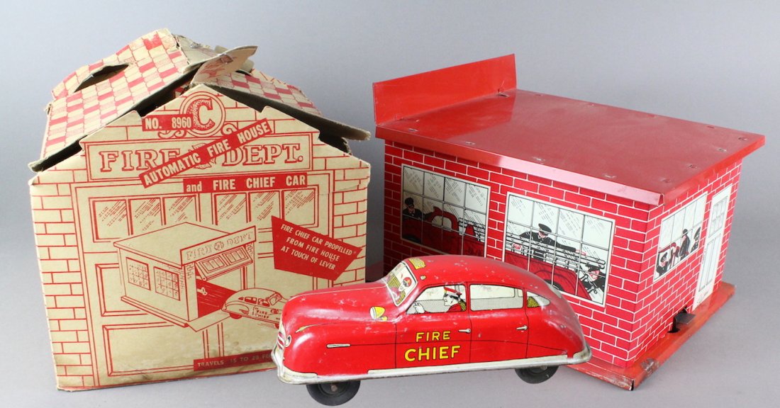 Courtland Fire Garage in Box & Fire Chief Car: Courtland Garage in Box with Fire Chief Car. Box is rough, garage and car have some wear, good overall. Car wind up is working.