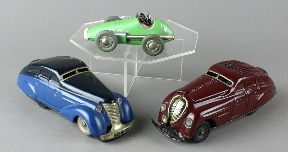 Schuco German Cars & Racer: Schuco original German tin cars and racer. Kommando Anno, 1010 Coupe and 1040 Micro Racer Wind up toys all made in Germany. Kommando has tin hood that reveals engine.