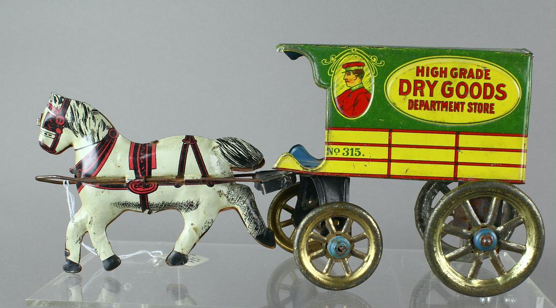 High Grade Tin Dry Goods Dept Store Wagon: High Grade Tin Dry Goods Department Store Horse drawn Wagon. Excellent tin toy litho. Scarce toy.