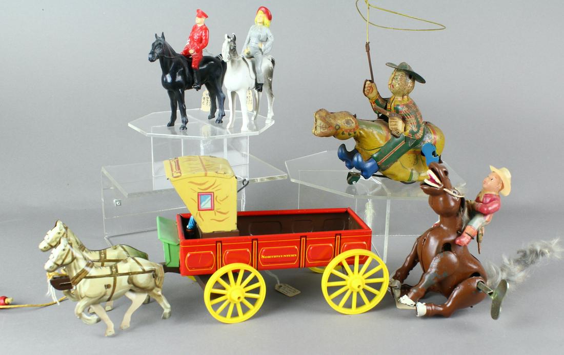 Japan Tin Toys Northwestern Wagon & Cowboys: Japan Tin Toys Norwestern Tin Wagon, Cowboys and riders. Chuck wagon is excellent. Wind up Cowboys are working, one with faded litho.