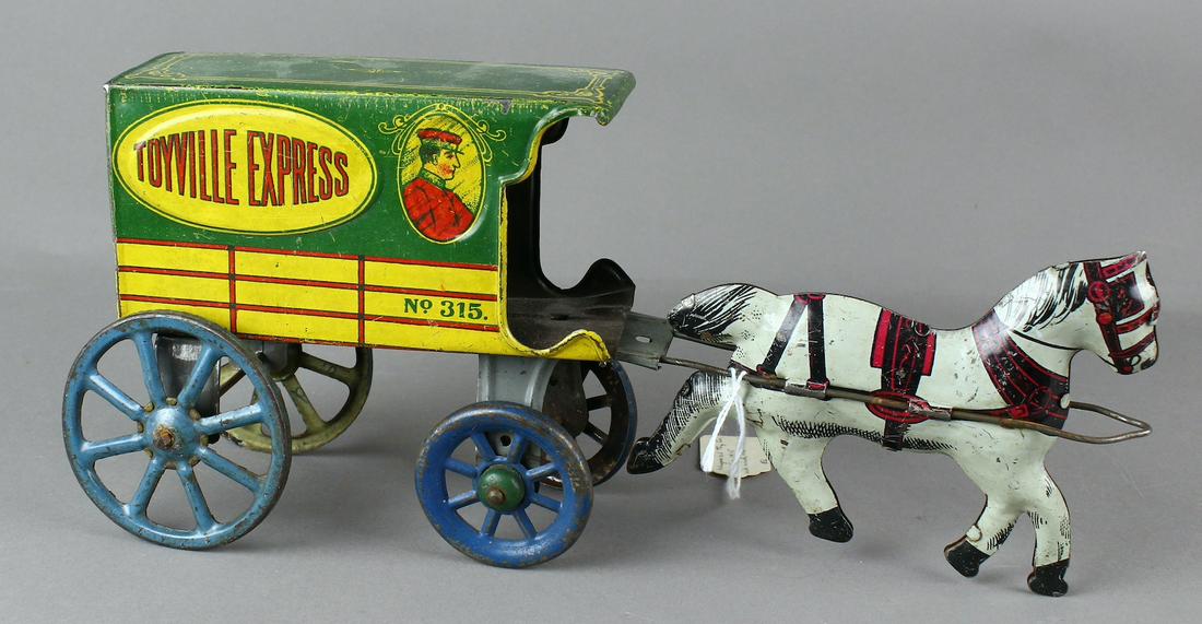 Non-Pareil Tin Toyville Express Delivery Wagon: Non-Pareil Tin Toyville Express Delivery Wagon. 12 inches long, excellent.