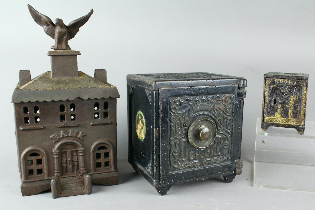 Eagle Finial & Royal Safe & Cast Iron Bank: Eagle Finial Bank Building 9 3/4 inches tall, Royal Safe Deposit 6 inches tall & Cast Iron Sport Bank- 1882 manufactured by Kyser & Rex. Royal Deposit and Sport Bank have original paint, Finial bank h