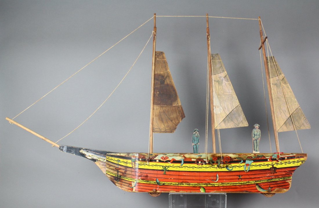 1883 Reed Volunteer Fishing Ship: 1880s Reed Volunteer Ship. Paper litho and wooden sail ship with details of men fishing, pulling fish onto ship. Some minor paper loss and staining with repairs to sails. Great sailing lithography, 32