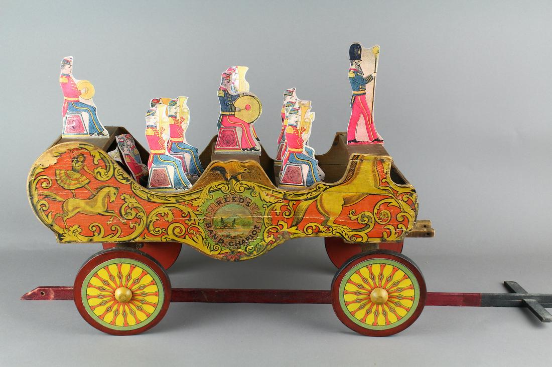 1890 Reeds Band Chariot: 1890 Reeds Band Chariot 27 inches long paper and wood toy with replaced figures.
