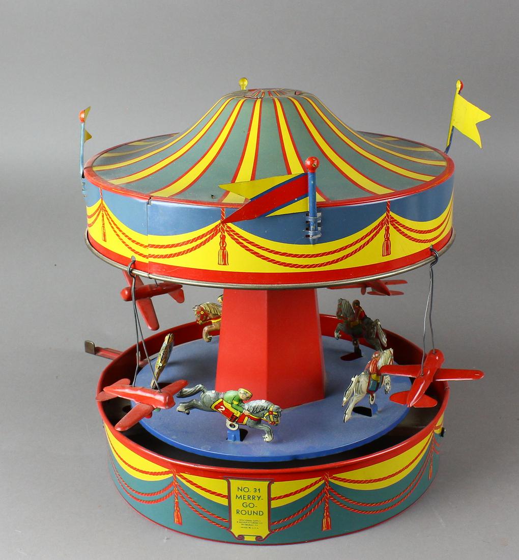 Wolverine Airplane & Horse Merry Go Round: Wolverine Airplane & Horse Merry Go Round. Tin working No. 31 Merry Go Round in excellent condition. Measures 12 inches high.