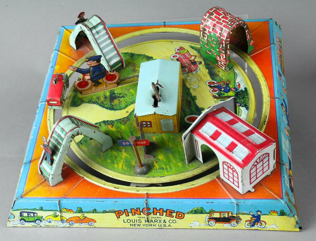1930s Marx PINCHED Speeding Car Police Trap: Marx \"Pinched\" Speeding Car Chased by\r\nPolice motorcycle track toy, with working clockwork, prewar. Speeding car attracts the attention of the hiding motorcycle cop who pops out to Pinch the offen