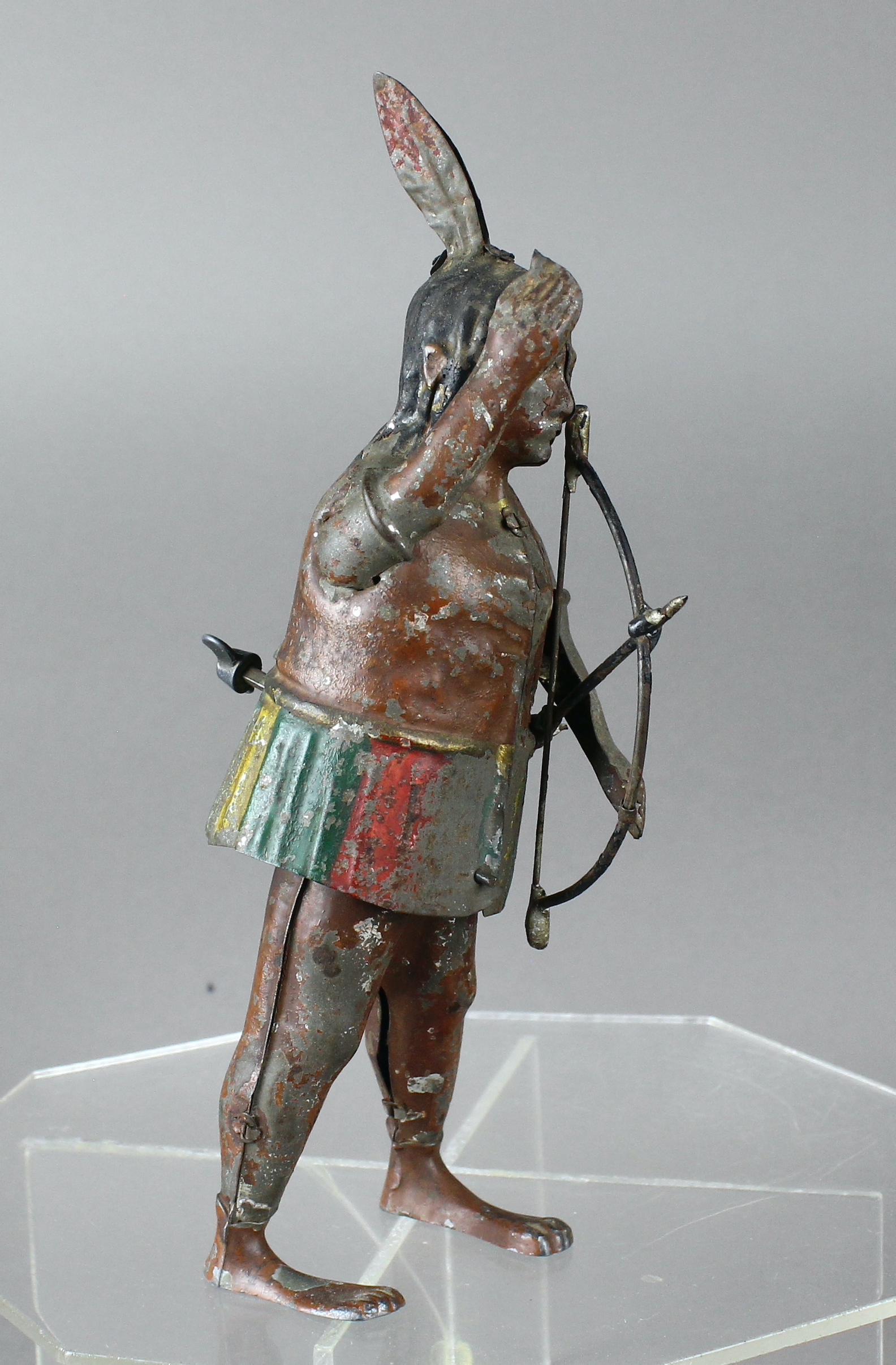 Gunthermann German Tin Indian Wind Up Toy: c.1910 Gunthermann German Tin Indian Wind Up Tin Toy with bow and arrow in hand. Scarce toy with wear and litho loss. 8 inches tall.
