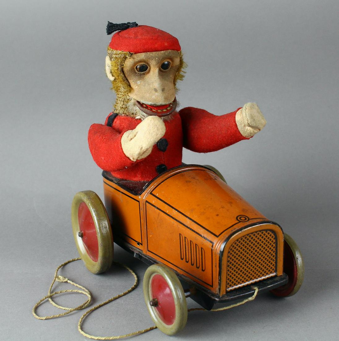 1920s Schuco Germany Monkey Driving Car: Schuco Germany Monkey Driving Car. Early Schuco (Schreyer Co.) tin coupe. Scarce early toy, 6 1/4 inches long.