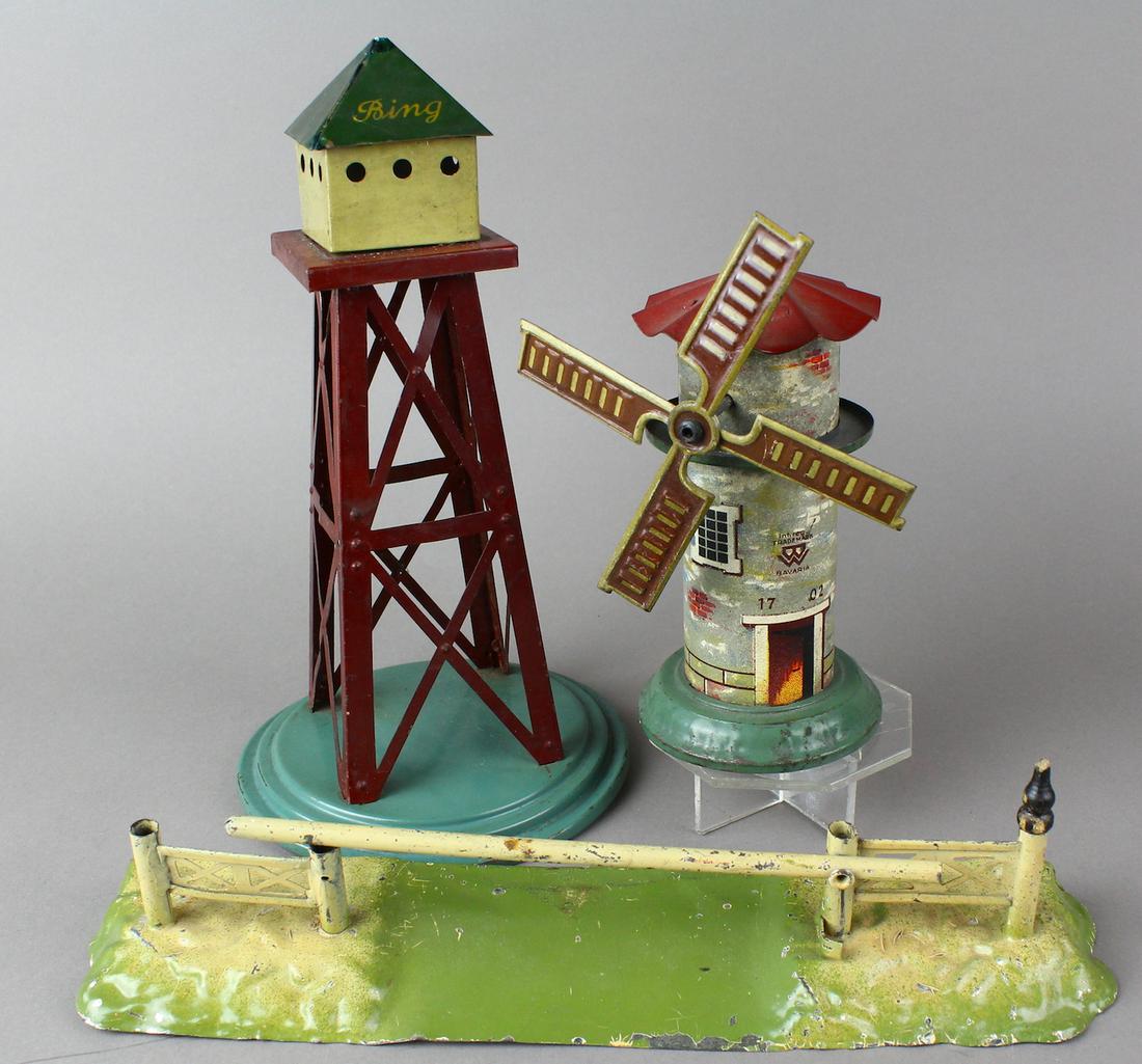Bing German Tin Buildings: Bing Airplane Tower, Bing Windmill, Bing Railroad crossing gate (hand painted). All in excellent original condition.