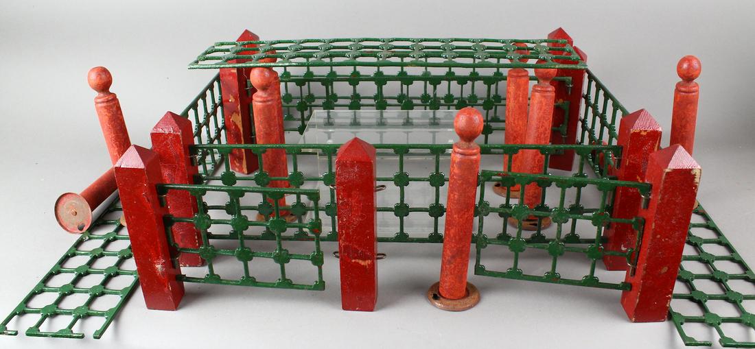 1900s Victorian Cast Iron Christmas Tree Fence: 1900s Victorian Cast Iron Christmas Tree Fence with gates, wood posts and extra wood posts. Turn of the century iron fencing used to surround the Christmas tree for display. Great for train sets aroun