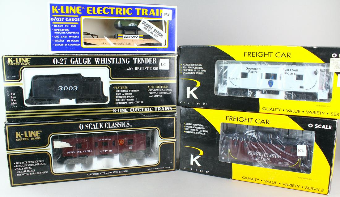 K-Line Rolling Stock & Tender in Boxes O Scale Trains: Boxed K-Line PRR Classic Caboose, Southern Pacific RR Police Caboose, PRR Caboose with Smoke unit, Whistling Tender, and Desert Storm Helicopter car. 5 K-Line Train cars.
