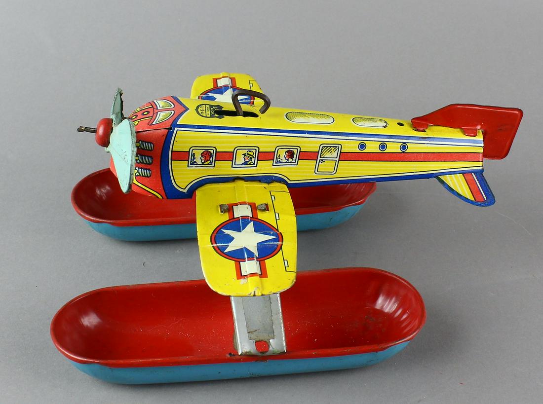 Chein Wind Up Tin Seaplane: Chein Wind Up Tin Seaplane. Original water wind up floating sea airplane toy. Working toy is 8 inches long.