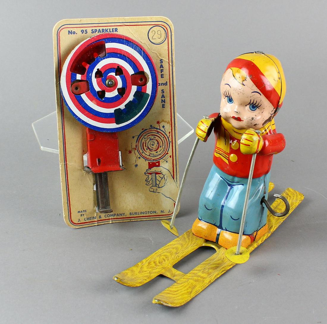 Chein Toys Ski Boy and Sparkler Toy on Card: Chein Toys Ski Boy and Sparkler Toy on Card. Working wind ups and nice litho.