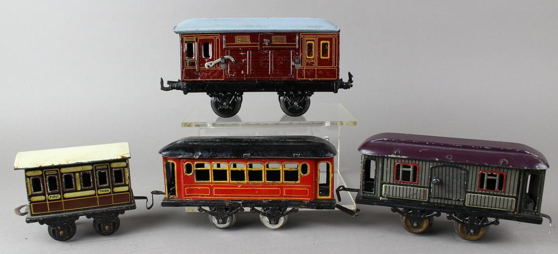 Bing & German Tin Litho Rolling Stock: German tin Pre-War trains. Bing scarce Horse Van with swing open window gates. Small Bing first & third class passenger car, 2 passenger/baggage cars unmarked.