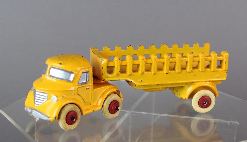 Slush Toy Stake Truck & Trailer: Slush Toy Stake Truck & Trailer. Unknown maker, Kansas? 6 inches long.