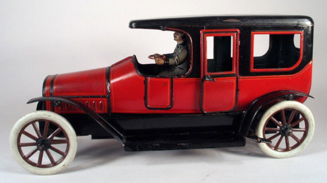 BUB: Large Limousine with Chauffeur/Officer 1929: BUB German tin (KARL BUB) limousine with chauffeur, working clockwork, pre-war circa 1920s. Beautiful very large limo with original litho driver and steering wheel. Complete example with tin painted w