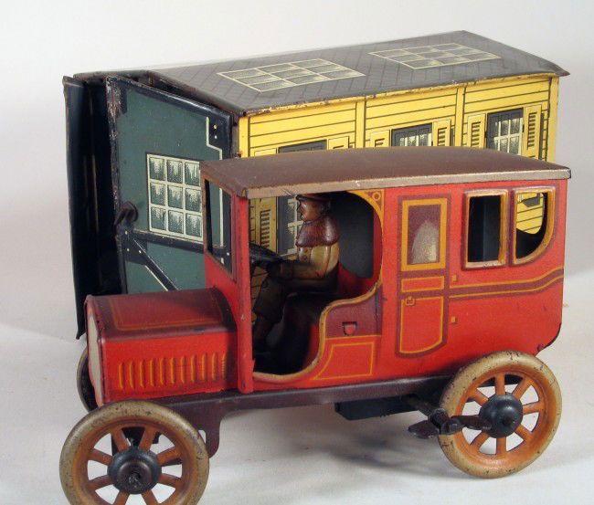 BING Garage Set with Early Limousine Wind Up 1920s: BING German tin garage set with early limousine, working clockwork, pre-war circa 1915-1920. Lovely garage set with red litho limo and single car garage. Very good condition. Complete with original dr