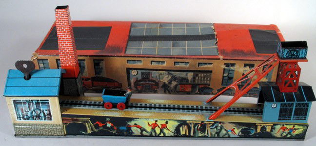 ARNOLD Mechanical Mine toy with Partial Box: ARNOLD German tin mechanical mine toy with partial original box, working clockwork, post-war circa 1950-1955. Very charming industrial German track toy. Complete with miner and cart, mine buildings, f