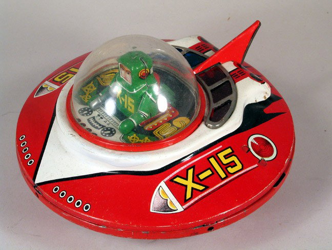 KO Yoshiya X-15 Space Ship Flying Saucer: KO (JAPAN): Yoshiya X-15 Sparkling space saucer circa 1950s. Tin flywheel crank drive produces mystery action. Good condition, no sparks, scarce space toy. Top half is loose, made to access replacemen
