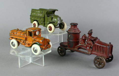 Hubley & A.C. Williams Cast Iron Vehicles: Hubley & A.C. Williams Cast Iron. Hubley Bell Telephone smallest, Williams fire engine, small tank truck. 4-6 inches, tanker may be repainted otherwise fine originals.