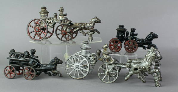 4 Horse Drawn Cast Iron Fire Wagons: 3 Fire pumper wagons, one ladder. Cast iron horse drawn wagons, longest 81/4 inches.