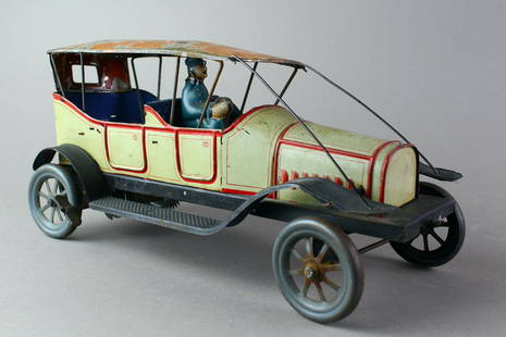 1920s Fischer German Tin Limousine: 1920s Georg Fischer German Tin Limousine clockwork wind up. Large German touring car with driver and pre-1930s style roof tie downs. Working with wear to roof, 10 1/2 inches long.