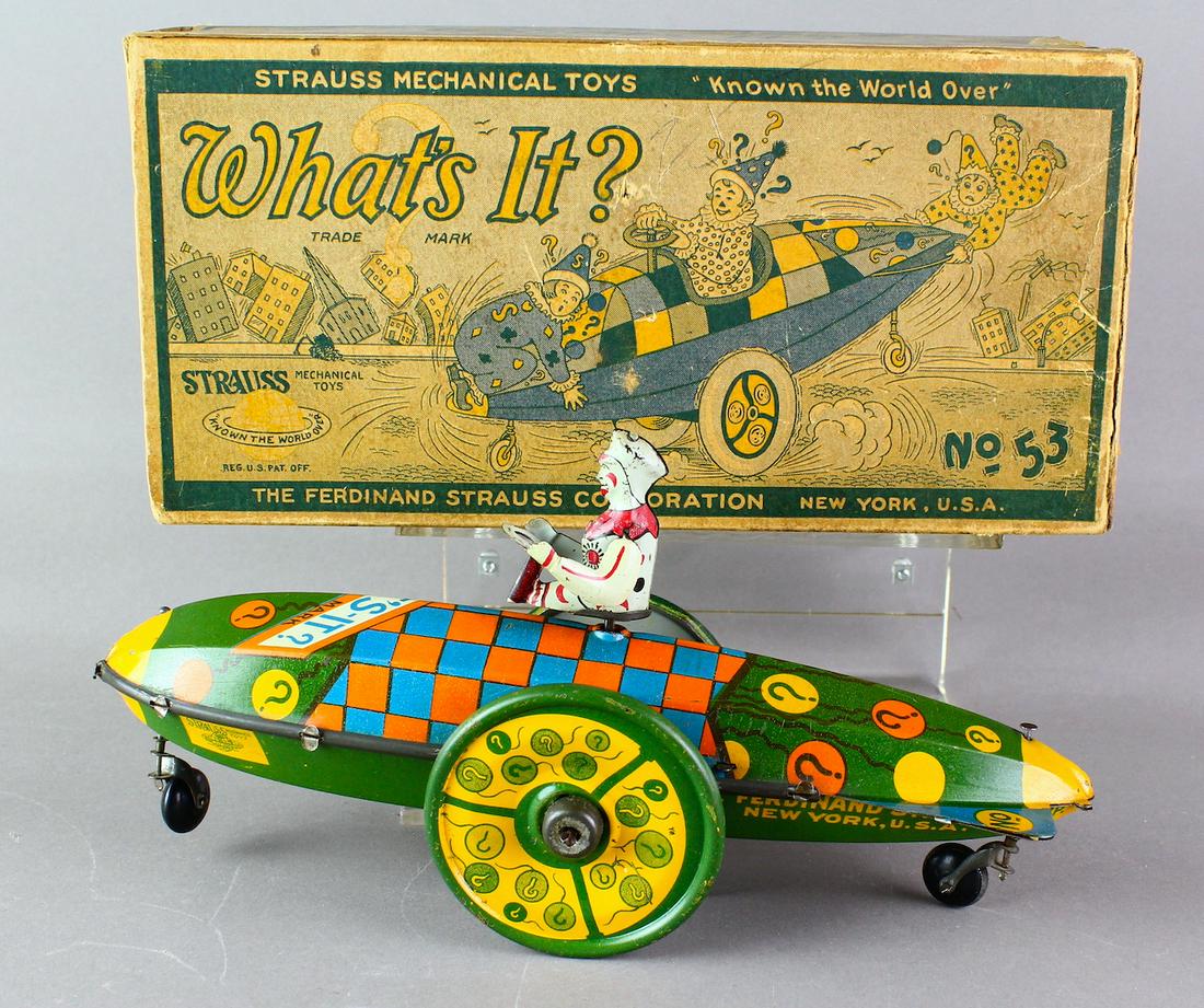1920s Strauss Tin Whats it? Clown Car In Box: 1920s Strauss Tin Whats it? In Box. Very rare toy in pristine condition and in the impossible to find original box. Early Ferdinand Strauss working wind up is 10 inches long. Fantastic graphics and bo