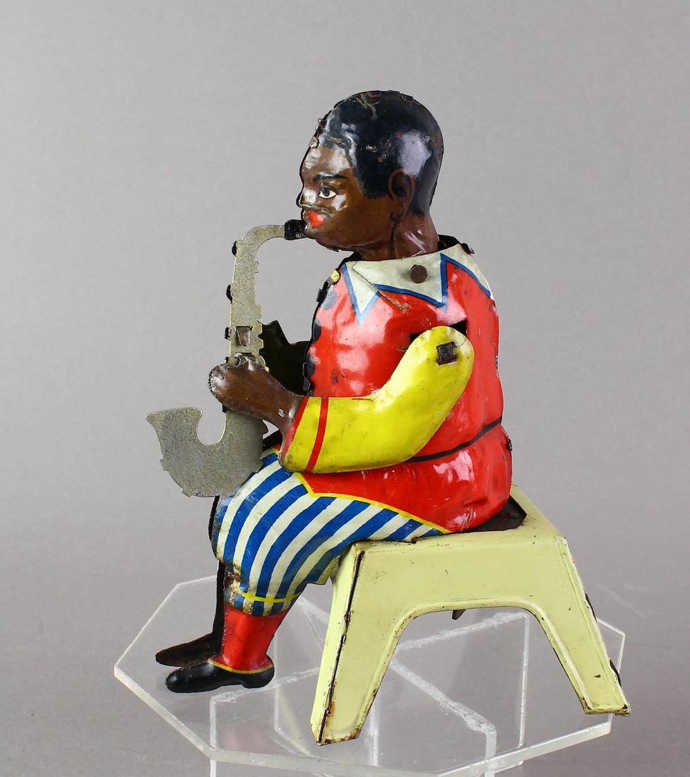 Gunthermann German Black Saxaphone Player: 1930s Gunthermann German Black Saxaphone Player. Wind up moves the Sax and plinks a sound, fine working condition 6 inches tall.