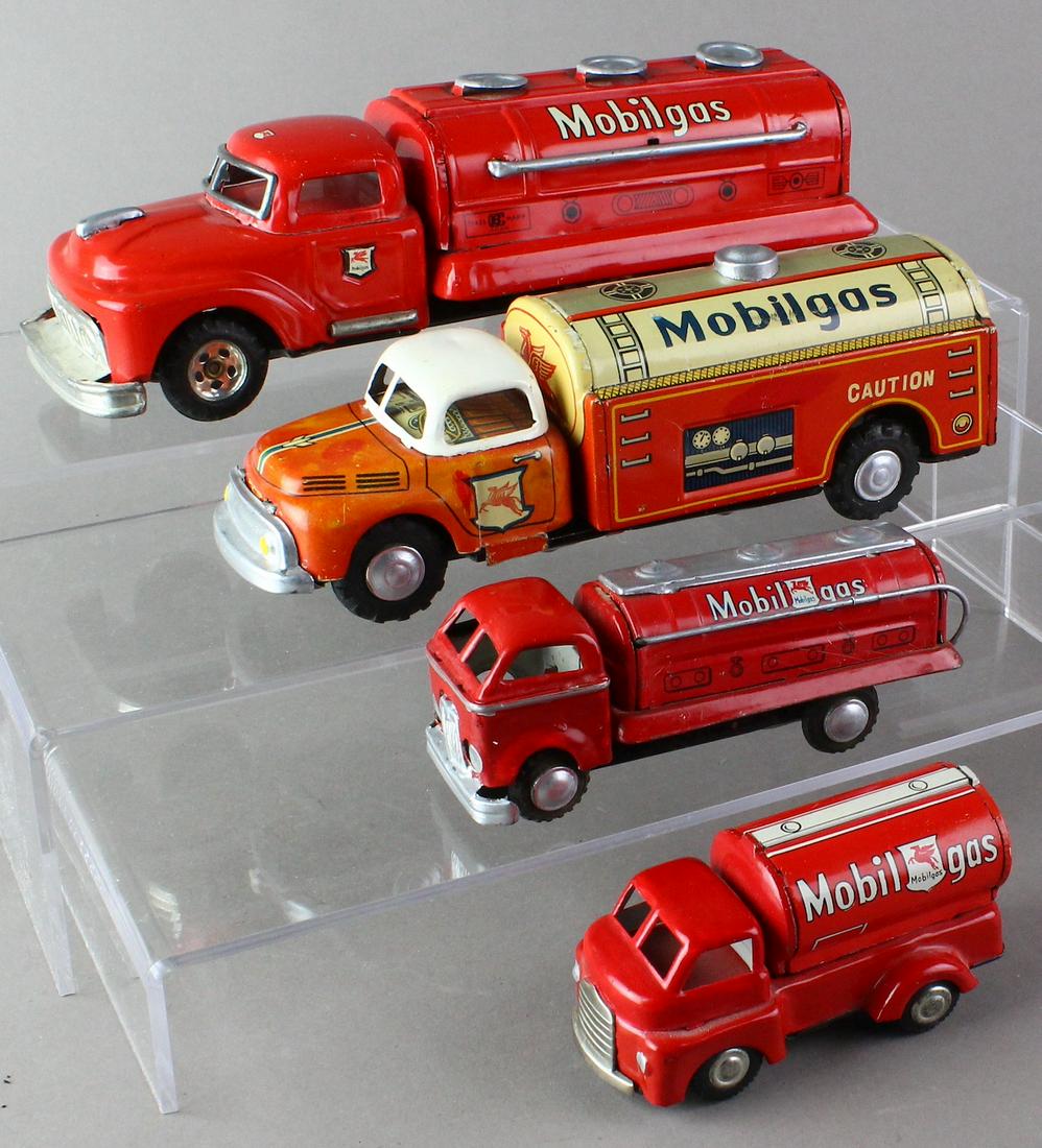 Japan Tin Mobil Gas Tankers: 4 Mobil-gas tin tanker trucks Japan tin toys. Longest 9 inches.