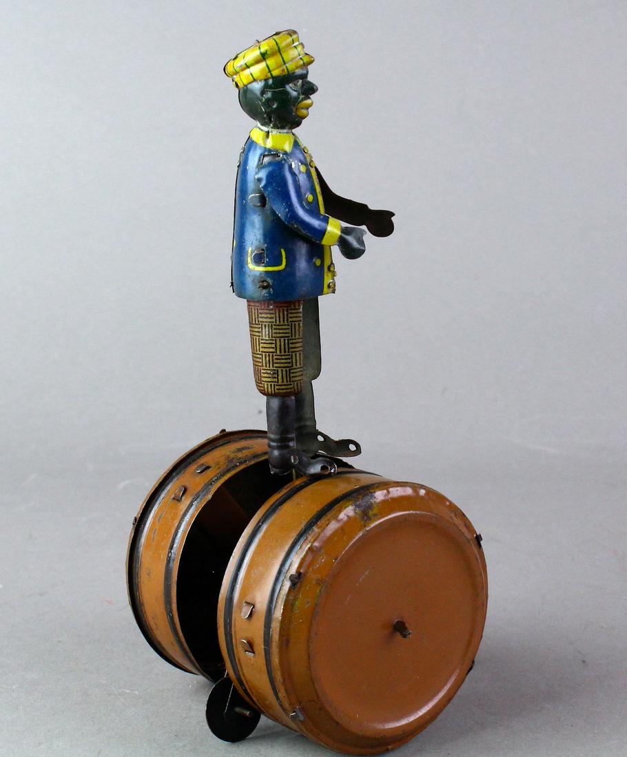 German Tin Rolling Rufus Black Man on Barrel Wind Up (1 of 4)