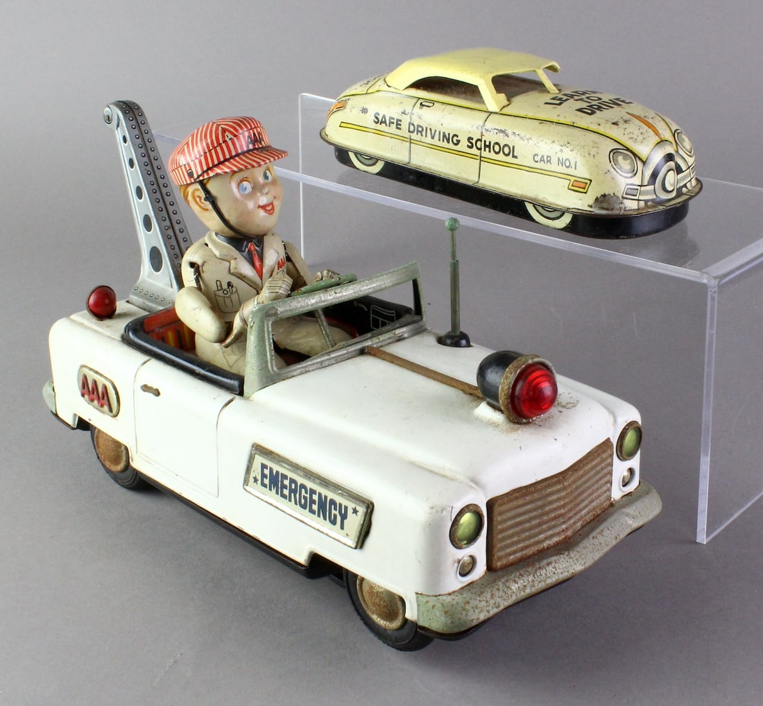 Japan Tin Triple A Wrecker & Marx Auto School: Japan Tin AAA Emergency Wrecker Battery Op & Marx Auto School Car. Auto School wind up works weakly, one side post missing. Longest 10 inches.
