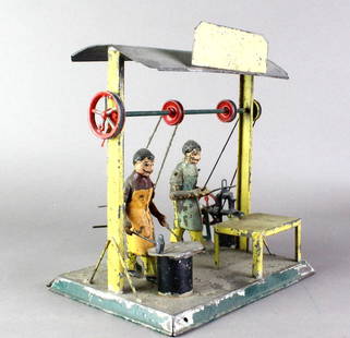 1900s German Tin Factory Men Blacksmith Forge Bing/Becker: German Tin Steam/Crank toy of men forging and working at metal factory station. Original working toy with pulley sets to run the action of the metal shaping press and metal forger. Beautiful German ti