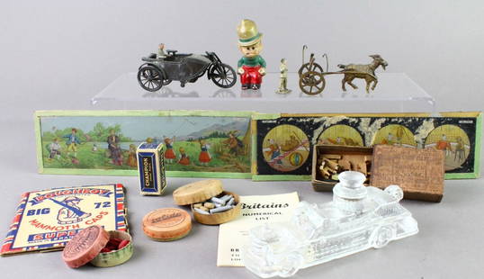 French Penny Toy Motorcycle, WWII Caps, Lantern Slides&: Mixed Toy Lot- French Penny Toy Motorcycle with side car, Man with horse penny toy, WWI Caps, Lantern Slides of Cartoon circus and children playing, Matchbox of German figures, Glass Fire Engine Candy