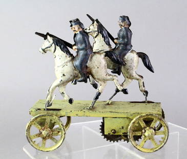 1900s Early German Tin Nickel Toy Wind Up Soldiers: Larger than a penny toy German tin Soldiers on Platform. Horseback riding 19th century soldiers that rise and fall with the forward motion of the toy. Excellent original paint/litho. 5 1/2 inches long