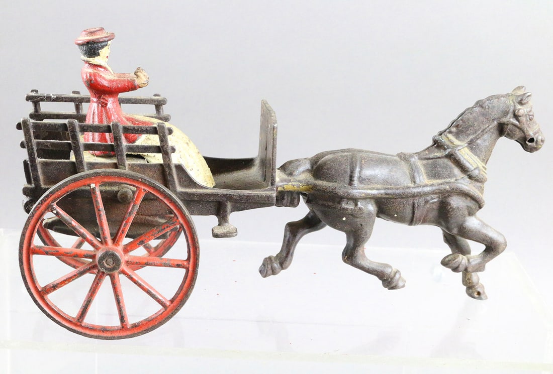 Cast Iron Woman Driving Horse Drawn Stake Wagon: Cast Iron Woman Driving Horse Drawn Stake Wagon. Possibly Wilkins or Shimer. 10 inches