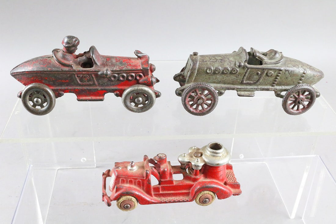 Cast Iron AC Williams Boat Tail Racers and Fire Engine: AC Williams Cast Iron Race cars and Fire Engine pumper truck.