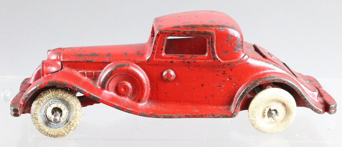 Arcade REO Cast Iron Rumble Seat Coupe: Arcade REO Cast Iron Rumble Seat Coupe. Wheels fatigued, one missing, original paint 7 1/2 inches