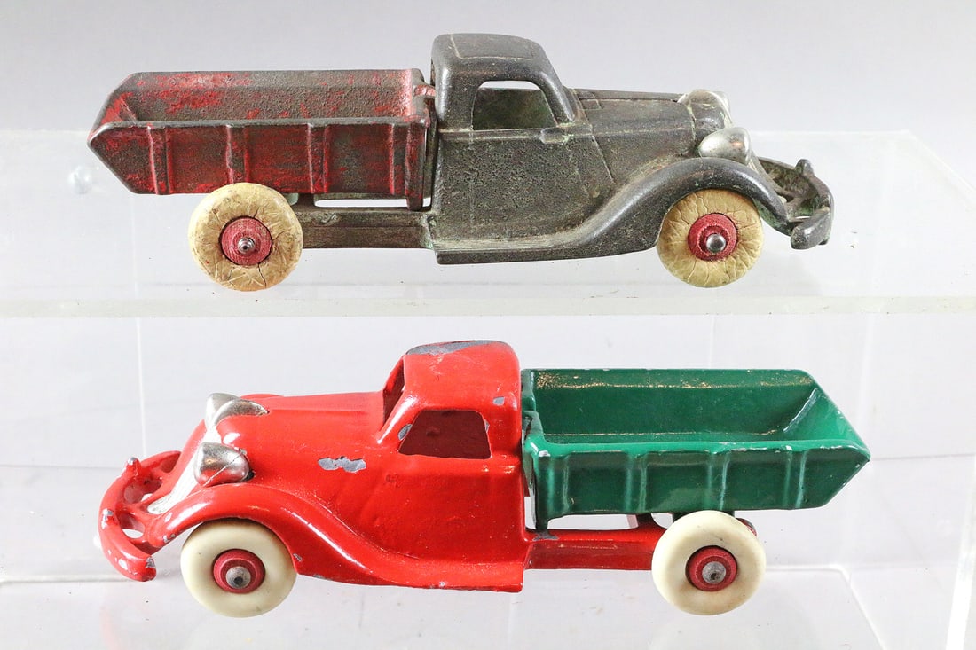 Cast Iron Dump Truck Lot: Cast Iron Dump Truck Lot 8 inches. Top appears to be Hubley, bottom truck contemporary.