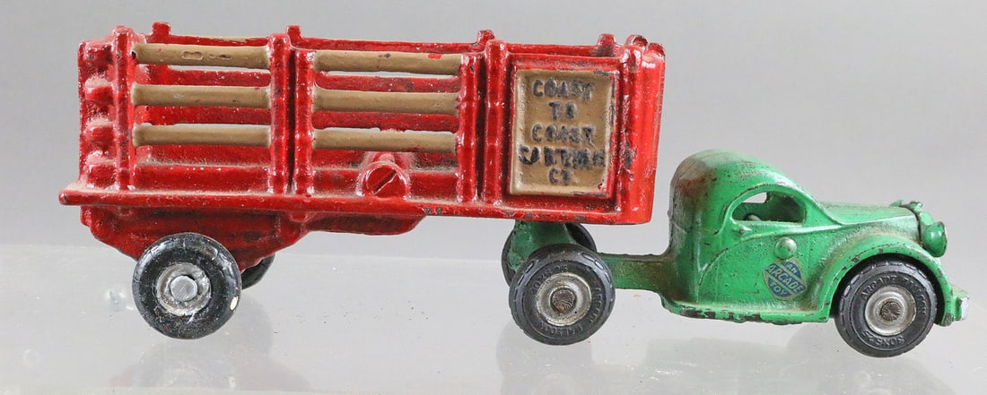 Arcade Cab and Coast To Coast Stake Hauler: Arcade Cab and Coast To Coast Cartage Stake Hauler 9 inches. Stake truck repainted, cab some touch ups. Stake body may be AC Williams.