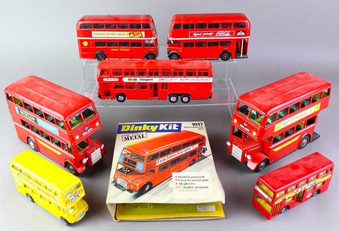 English Double Decker Bus Collection: 2 Japan Tin friction and 1 Japan Yonezawa Diecast for the Japanese market (middle), Dinky Kit build a bus in the box, 2 Solido, 1 Corgi, 1 Dinky, Double Decker British bus group. 8 Total, longest 8.5