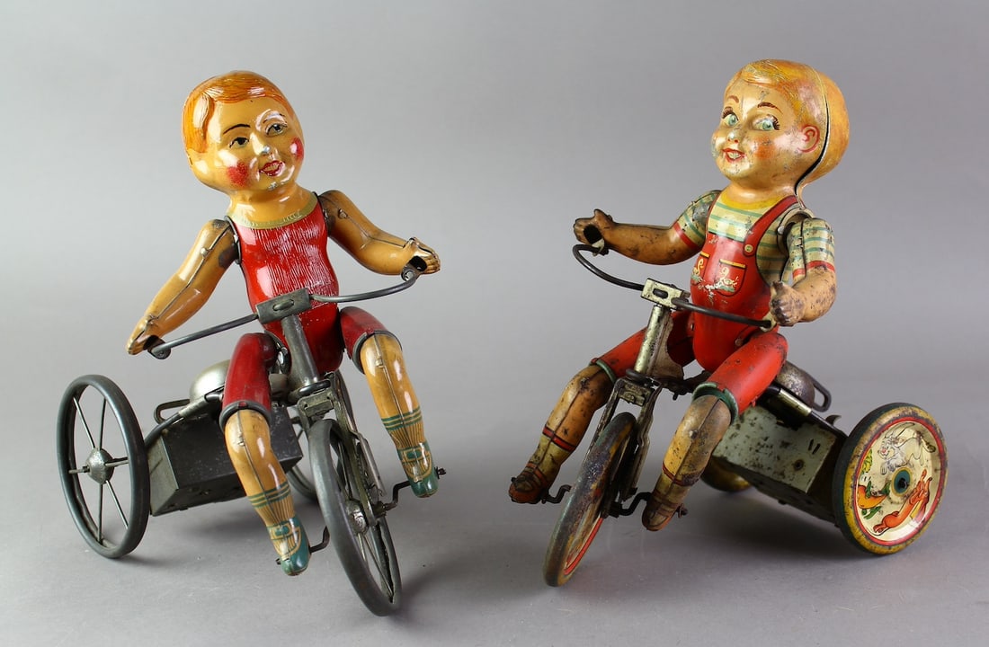 Marx Wondercyclist & Unique Art Tin Tricycles: Marx Wondercyclist & Unique Art Tin Tricycle wind up trike toys. Playwear on the Unique Art, Marx is excellent. 8 3/4 inches tall.