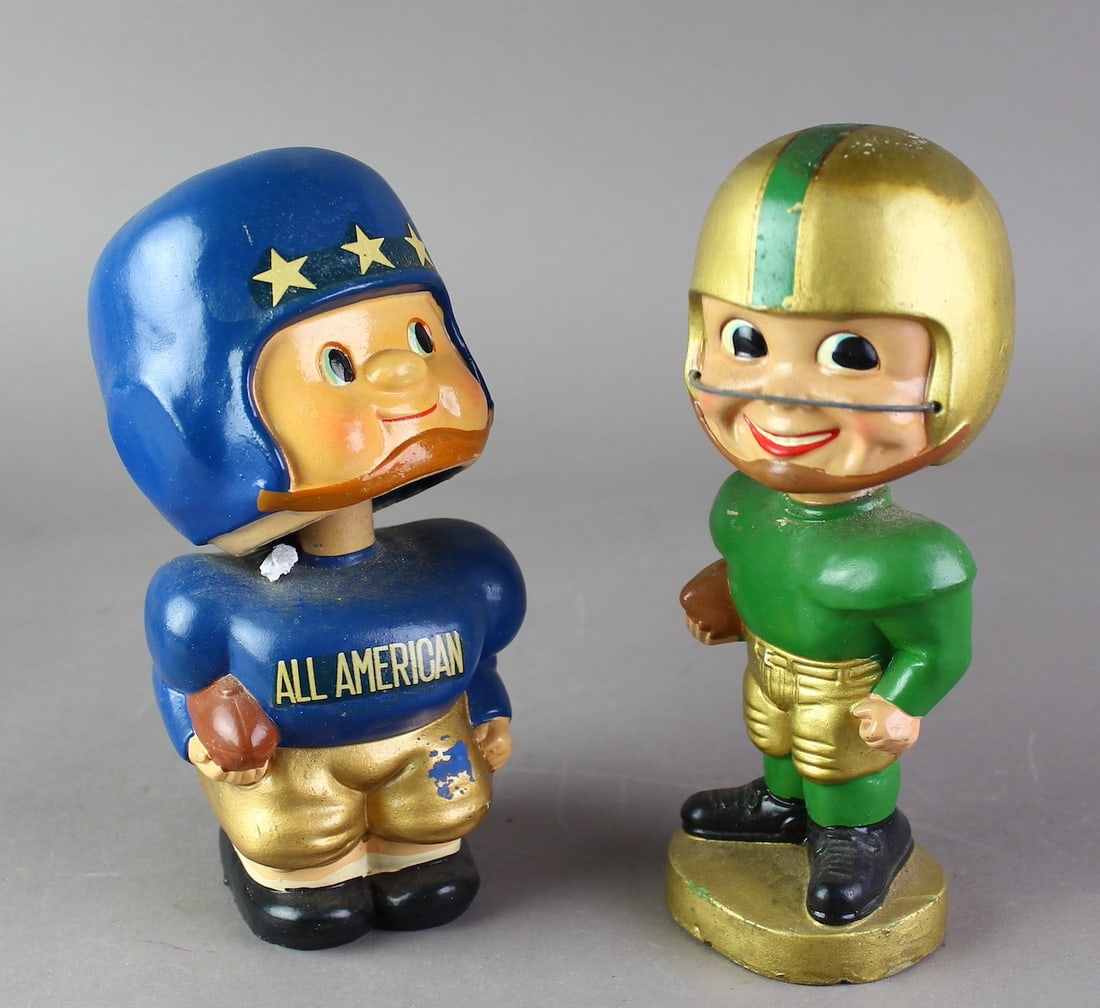 Pair of Japan Football Player Nodders: Japan Football Nodders All American and Green football player nodder.